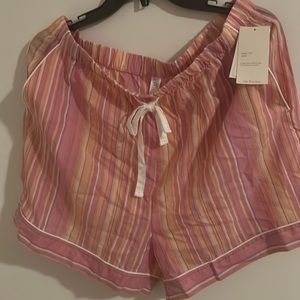 Stars above brand name, size L, and color pink